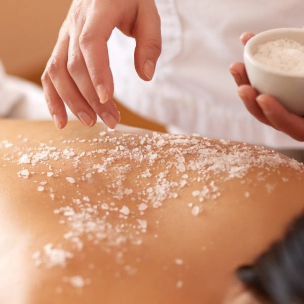 Spa,woman.,brunette,getting,a,salt,scrub,beauty,treatment,in