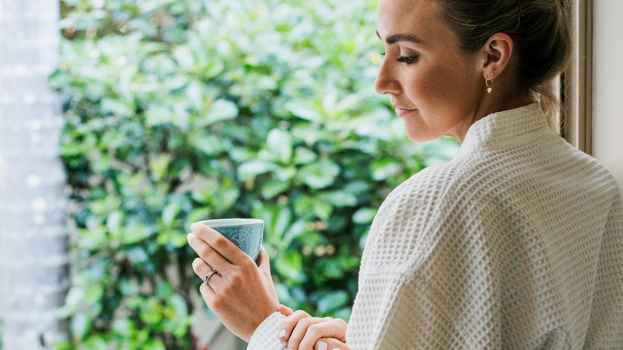 Woman Relaxing With Cup Of Tea