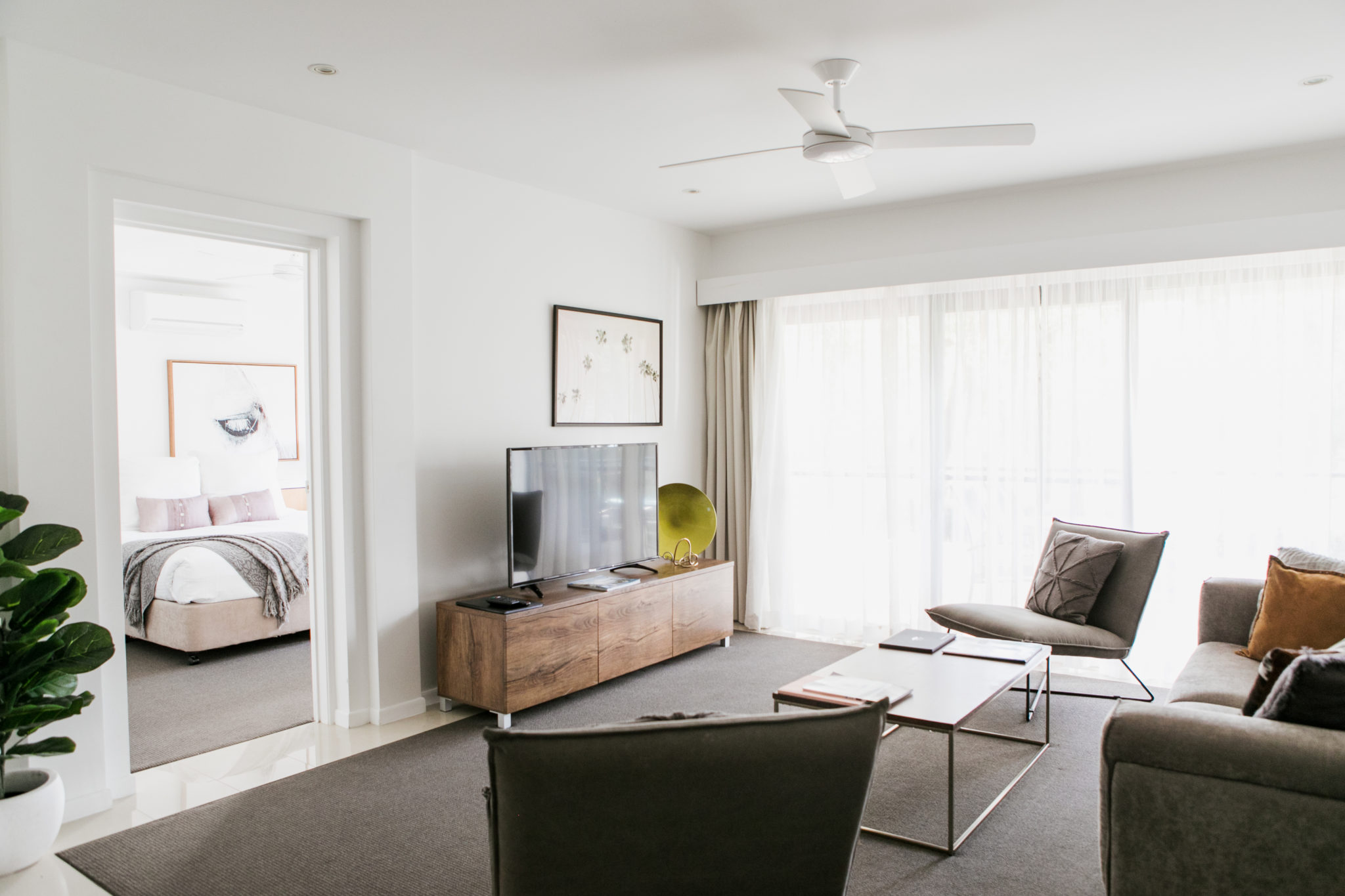 View of the Living Room with sofa, chairs and TV