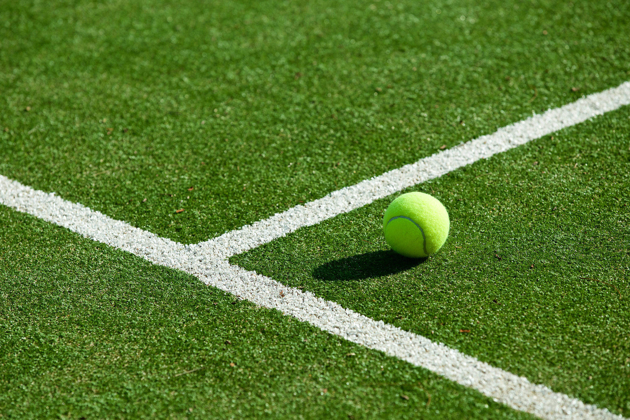 Tennis,ball,on,tennis,grass,court