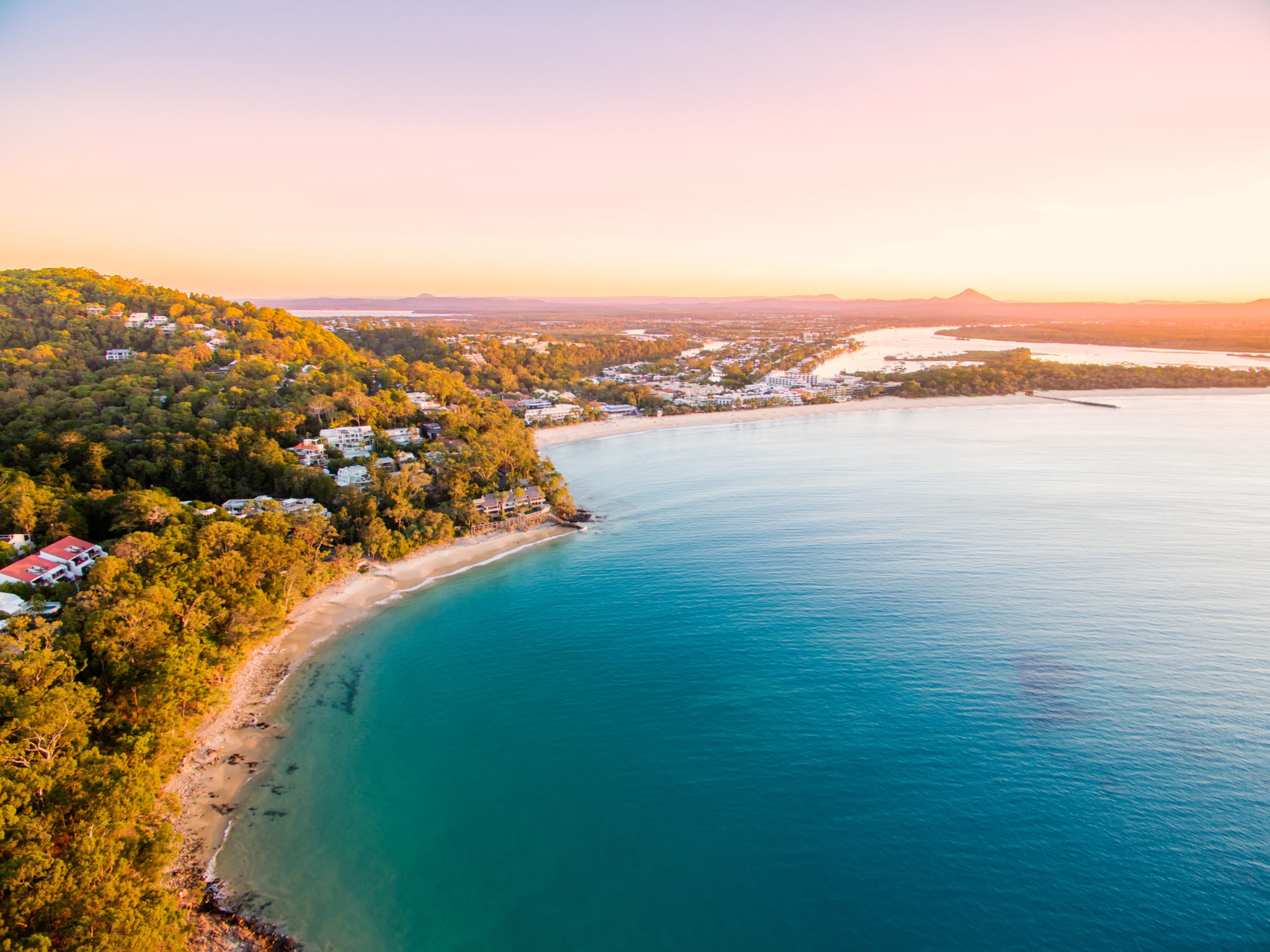An aerial view of noosa national park at sunset